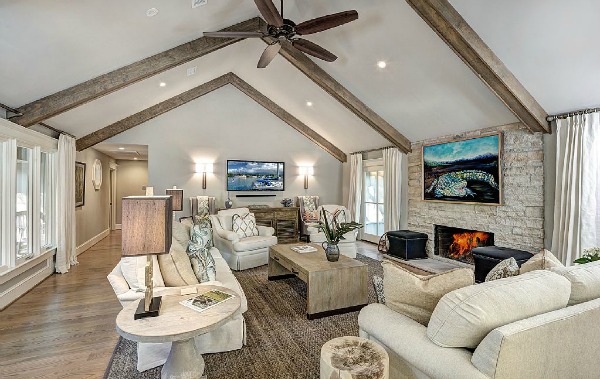 A living room filled with furniture and a fireplace