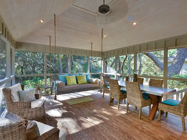 screened porch with sofa swing, table and chairs