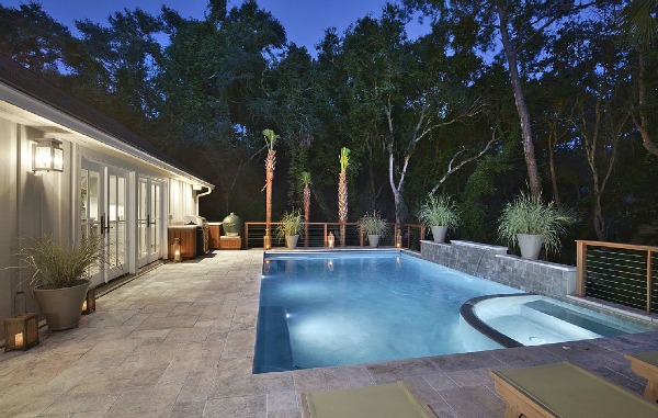 pool and patio beside house