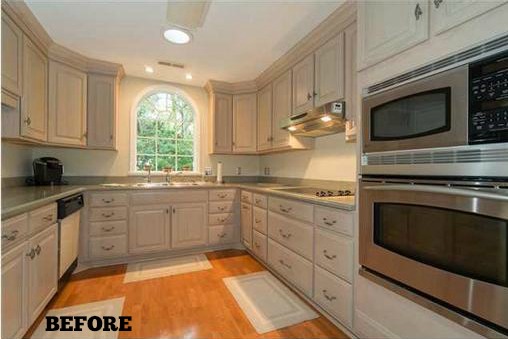 Kitchen with stainless steel appliances and wooden cabinets before remodel