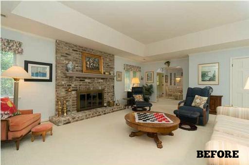 A living room filled with furniture and a fireplace