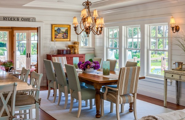 A dining room table in front of a window