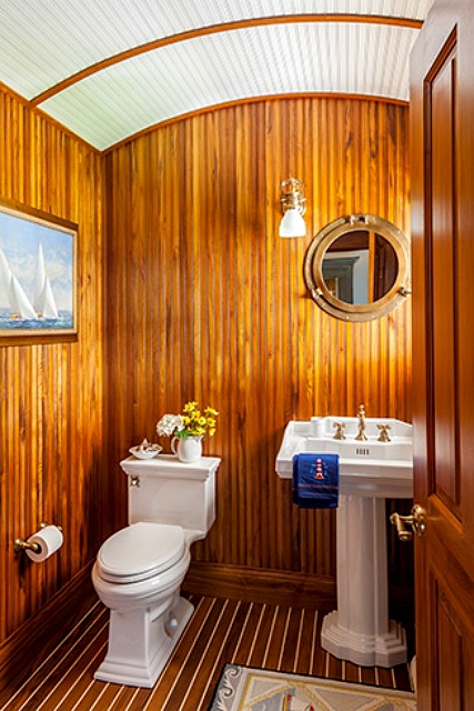 Bathroom with barreled ceiling and wood-paneled walls in Cape Cod | hookedonhouses.net