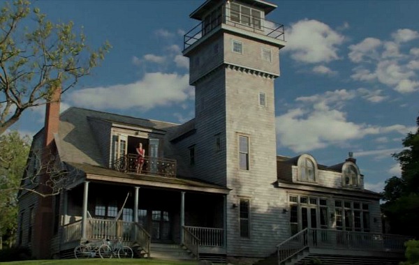 back exterior of shingle style beach house with tower seen on Girls