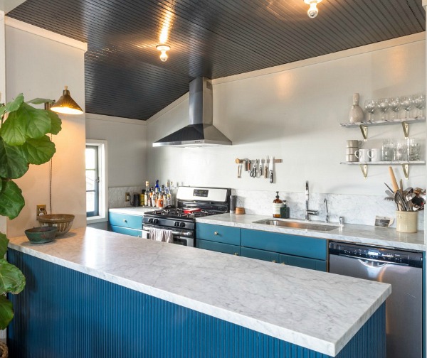 small kitchen with blue cabinets