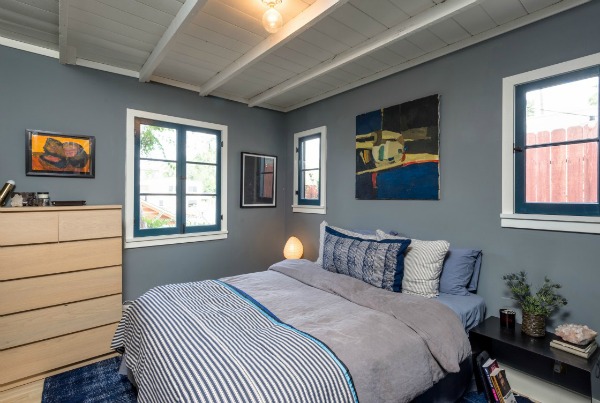 A bedroom with gray walls