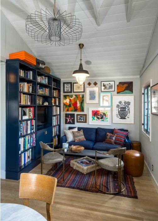 small living room with blue bookshelves and blue sofa