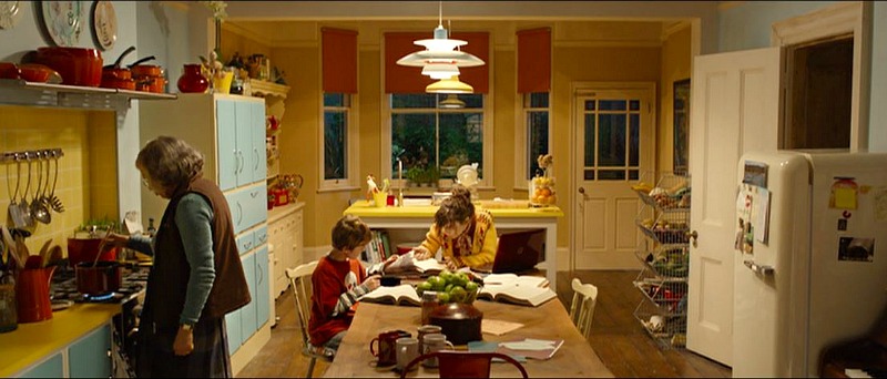 Mother and son sit at kitchen table