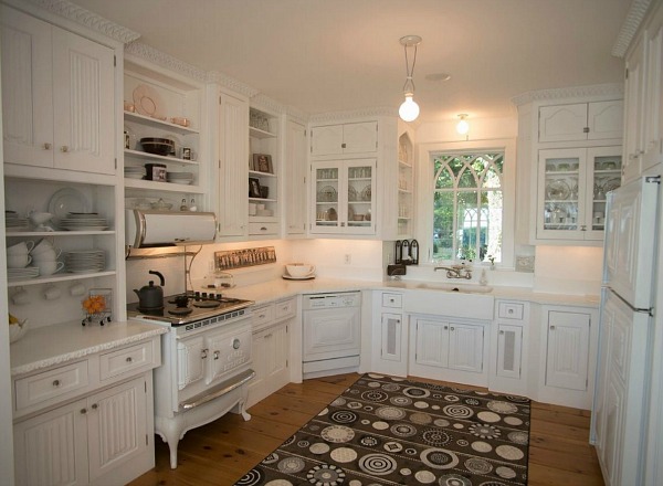 kitchen with vintage range and white cabinets