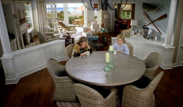 Grace and Frankie\'s dining room with round table and rattan chairs