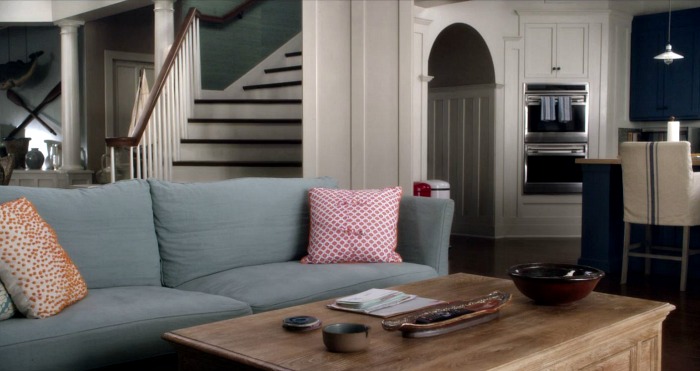 Beach house family room with blue sofa on "Grace and Frankie"