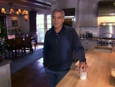 George Clooney standing in his kitchen