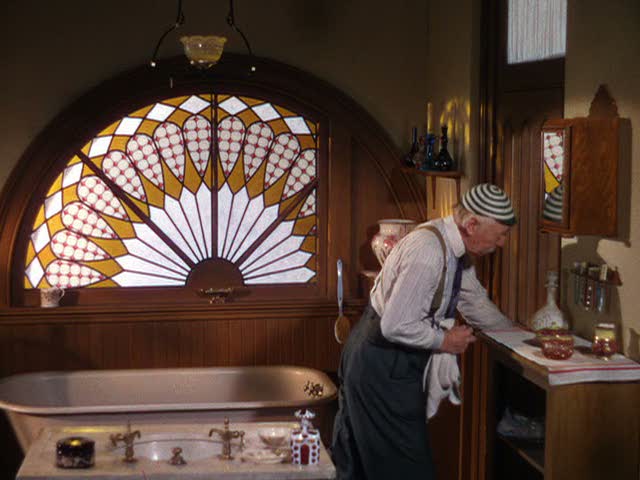 grandpa in the bathroom with stained glass window