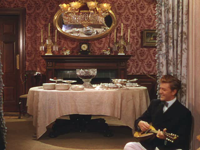 dining room with boy playing ukelele