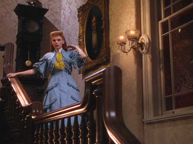 Judy Garland walking down staircase in movie scene