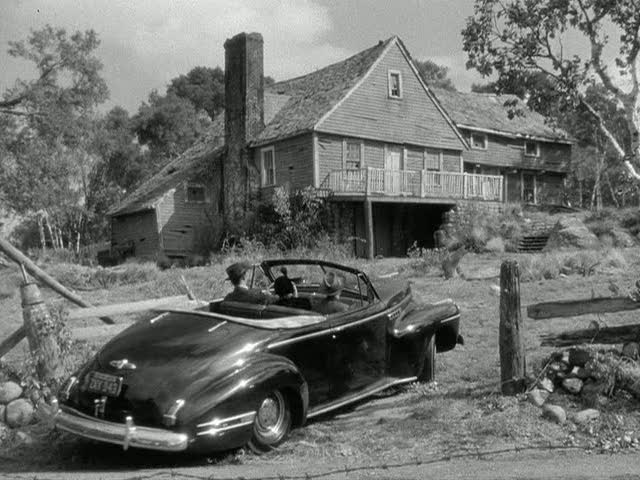 A car parked in front of a house