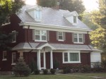 A house with trees in the background