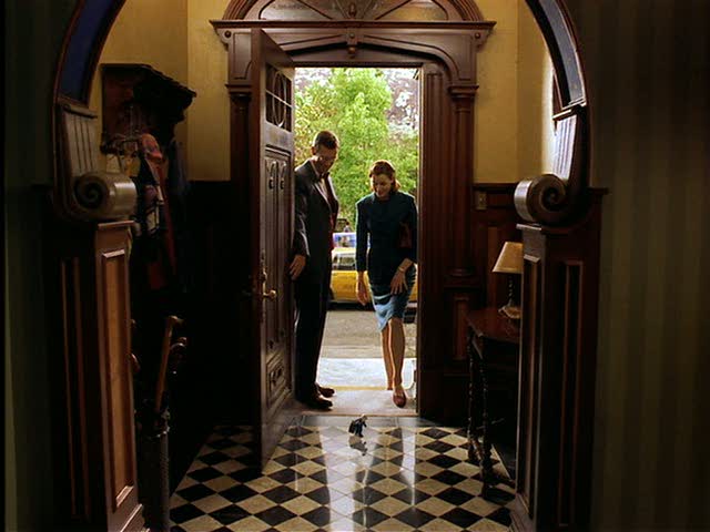 entry hall with black and white checkerboard floor