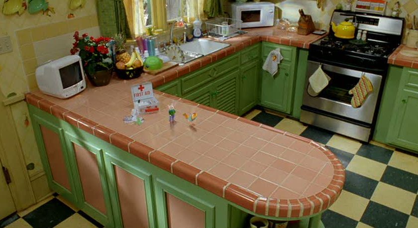 A kitchen with green walls