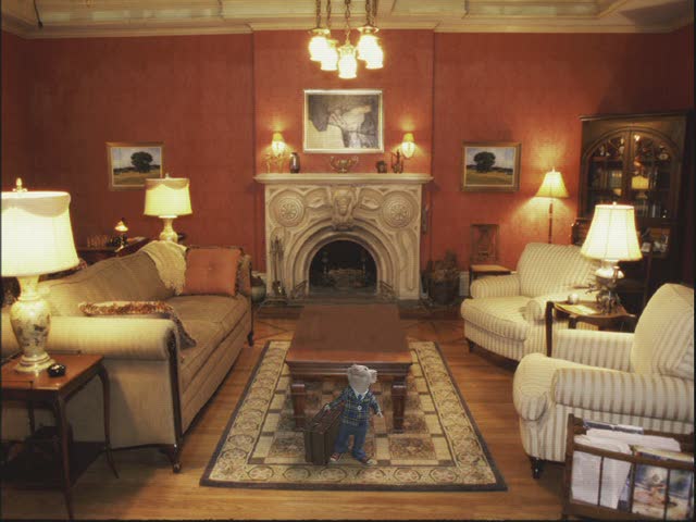 A living room filled with furniture and a fireplace