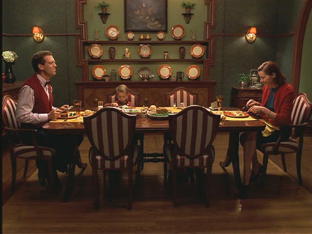 family sitting at dining room table