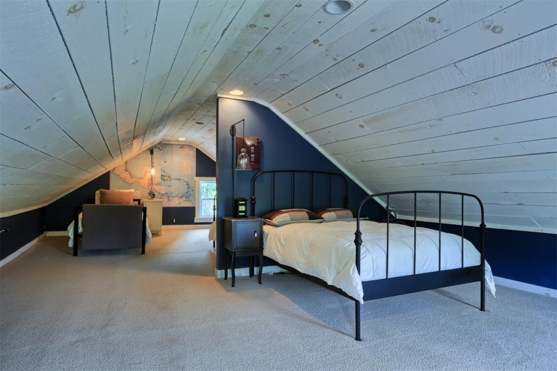 attic bedroom with iron bed