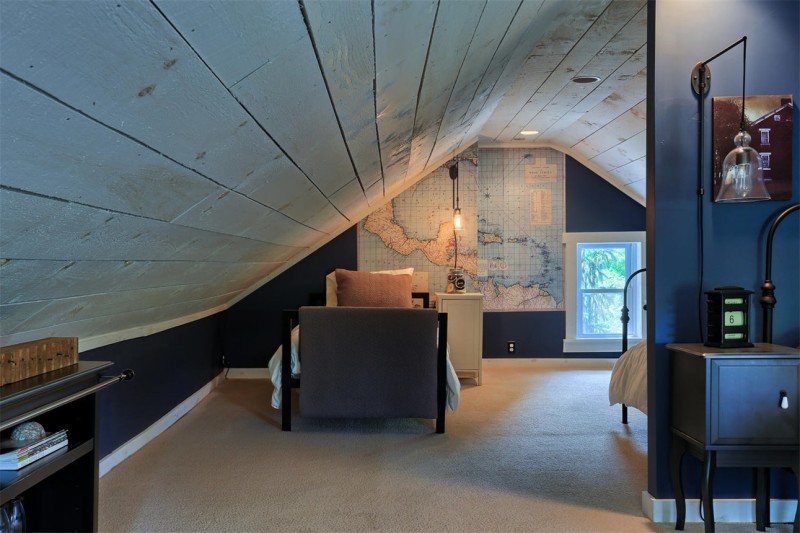 attic bedroom with sloped walls