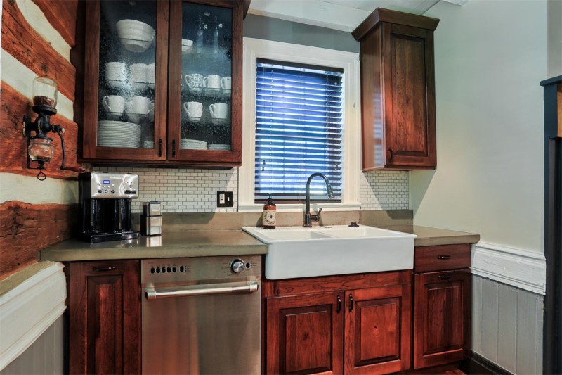 A kitchen with stainless steel appliances and wooden cabinets