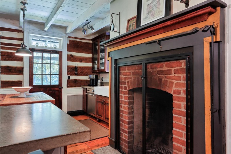 close up of brick fireplace in kitchen