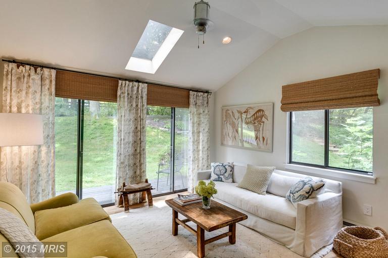 A living room filled with furniture and a large window