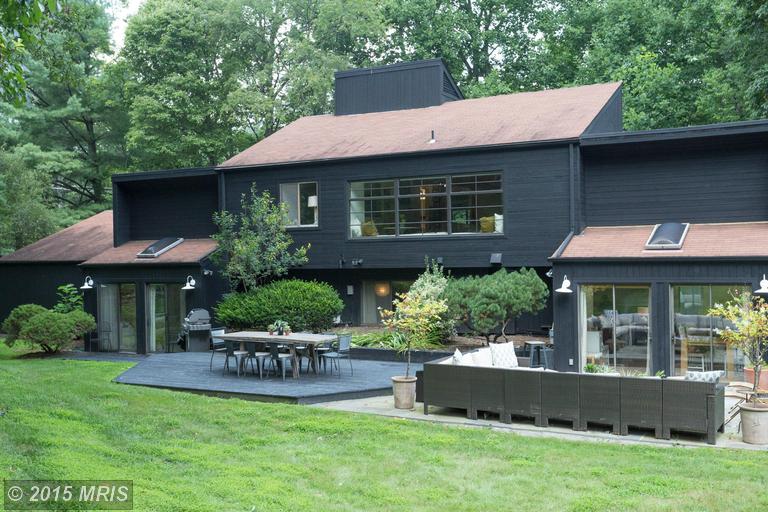 back exterior view of house painted black