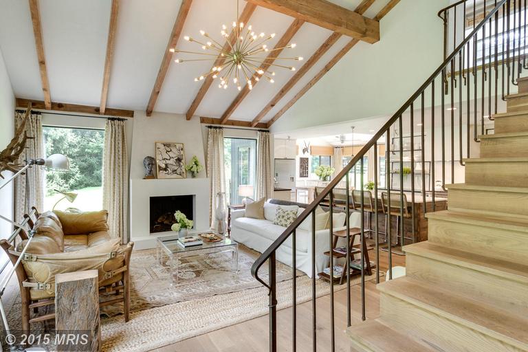 A living room filled with furniture and a fireplace