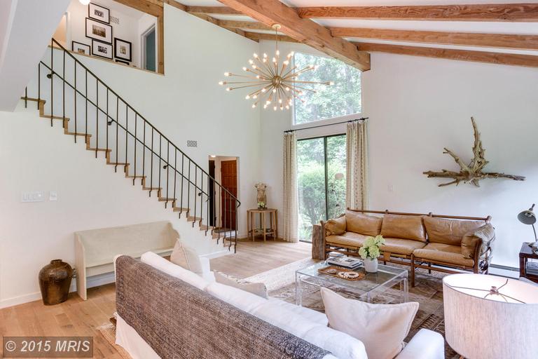 iron staircase leading up from living room