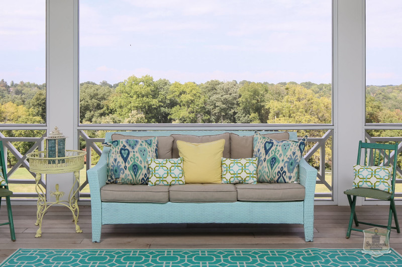 blue outdoor sofa on back porch