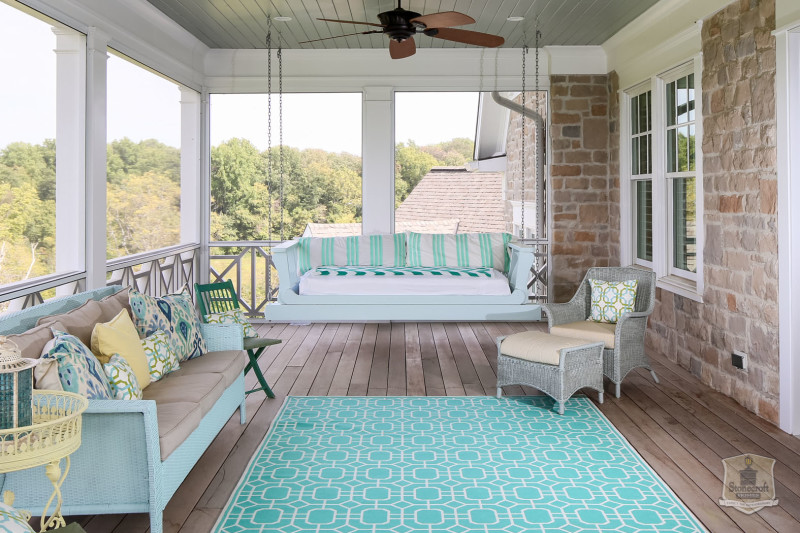 back porch with seating and swing