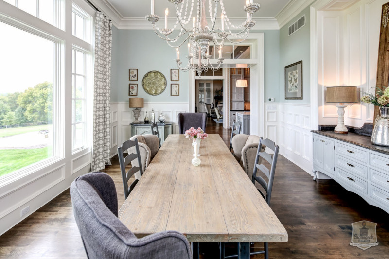 dining room table and mismatched chairs