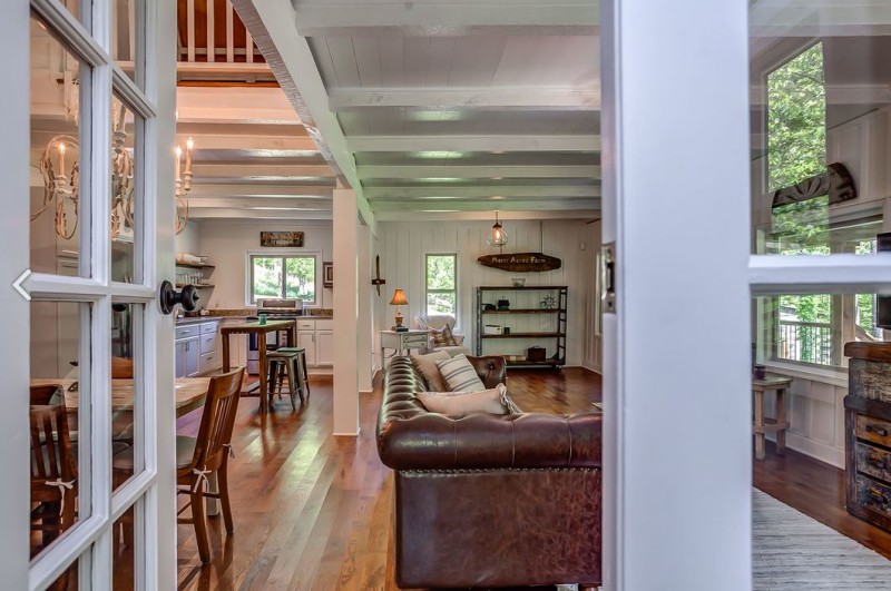 leather sofa in living room seen from bedroom door