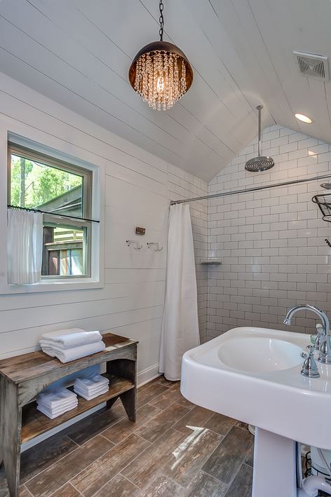 white bathroom with subway tile and shiplap