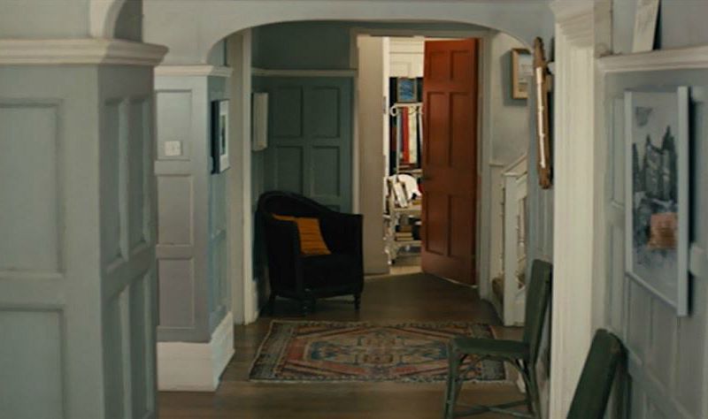 The hallway with chair and door in house