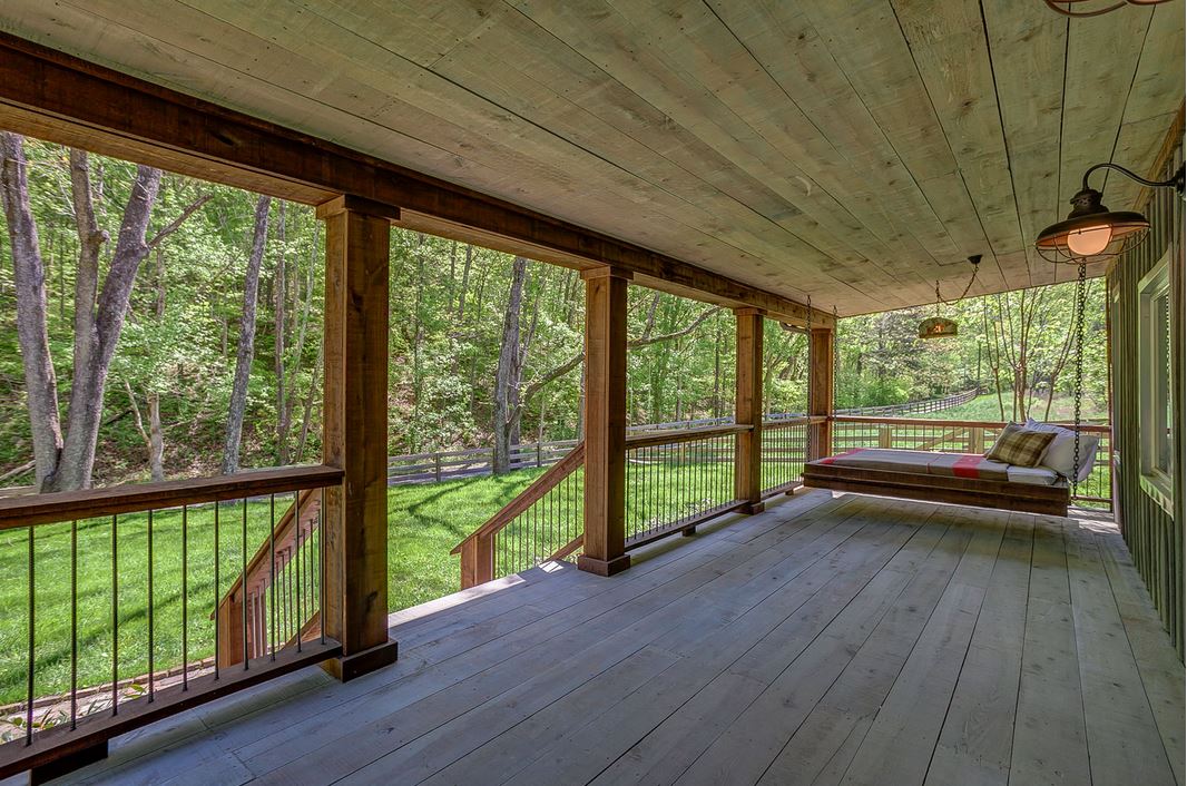 large front porch with bed swing