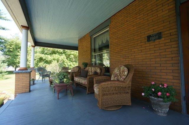 front porch of house with wicker seating