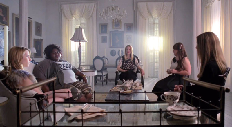 witches gathered in Miss Robichaux's Academy living room AHS Coven