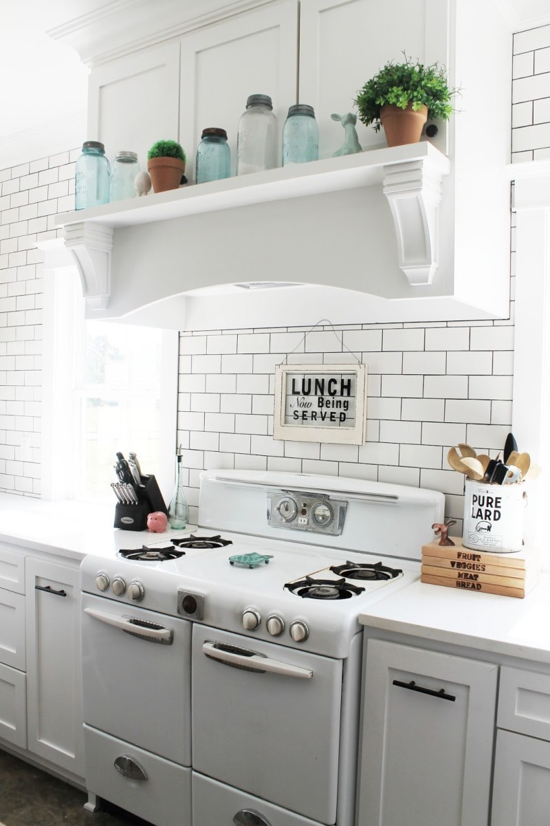 Vintage kitchen stove with sign that says Lunch is being served