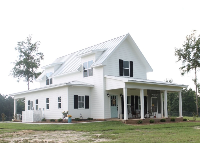 Brittany York\'s Sugarberry Cottage Farmhouse with black shutters and front porch