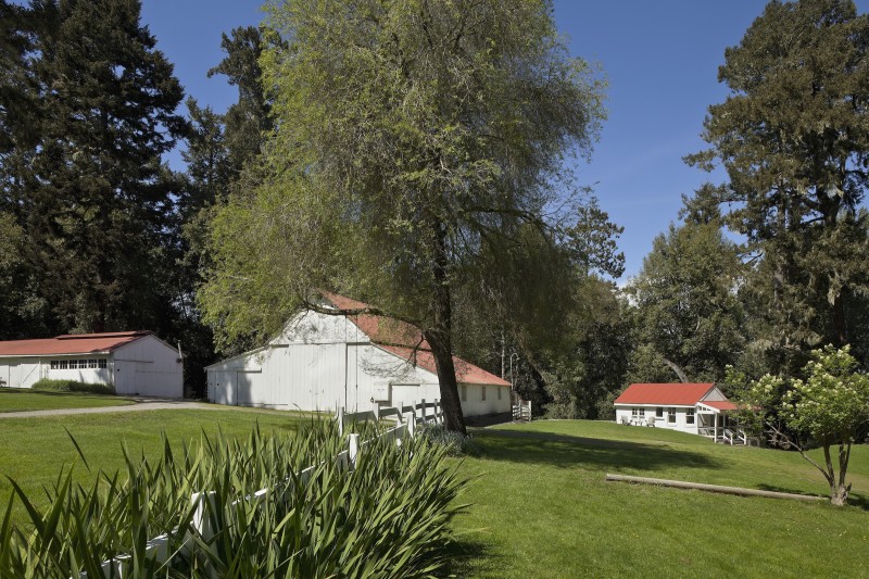 White barn and property around Inverness Family Camp Bath House