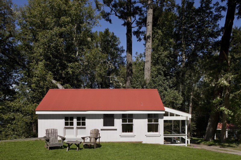 Side view of Inverness Family Camp Bath House with red roof