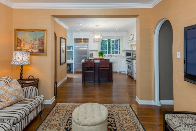 remodeled kitchen with white cabinets in Spanish style home