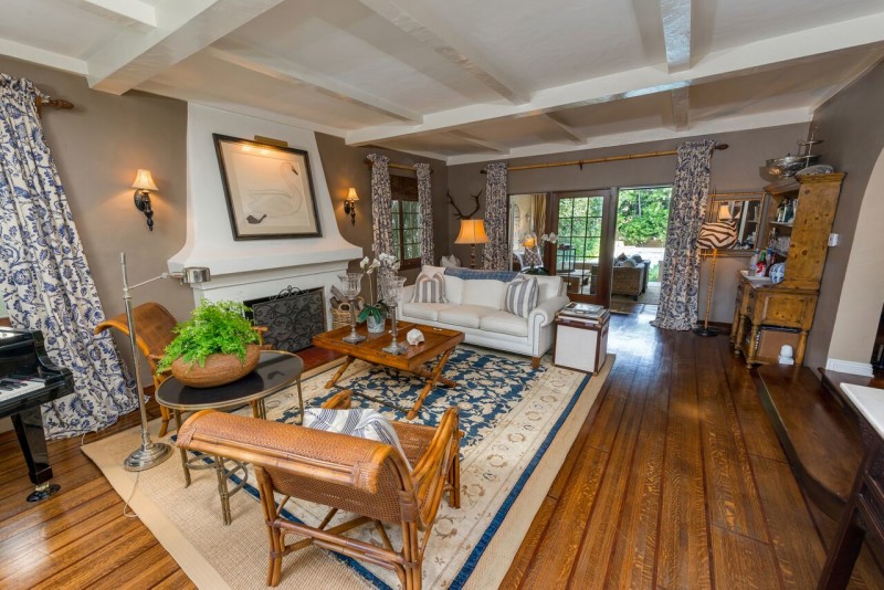 A living room filled with furniture and a fire place