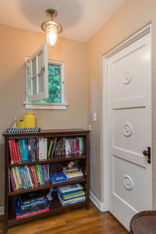 small window over bookshelf