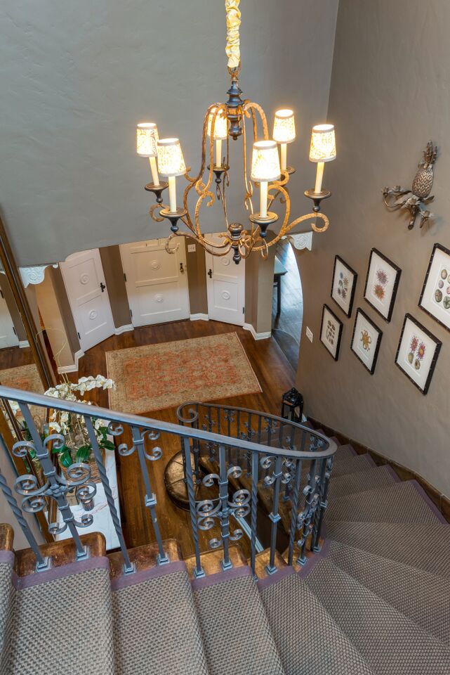 looking down into entry way from top of staircase